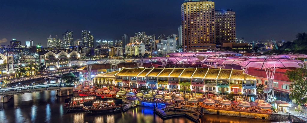 Bustling nightlife at Clarke Quay with vibrant lights