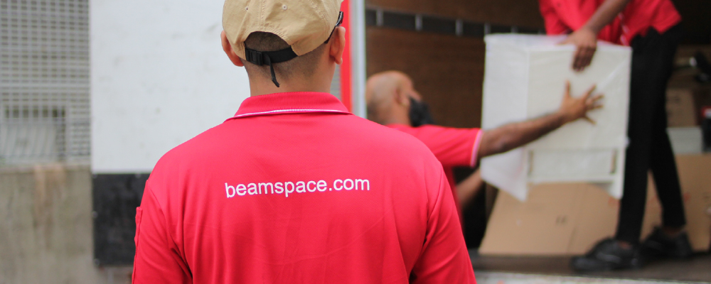 BEAM Space pickup team collecting boxes from an apartment