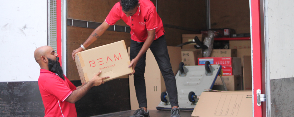 BEAM Space Crew loading boxes into BEAM Space collection van